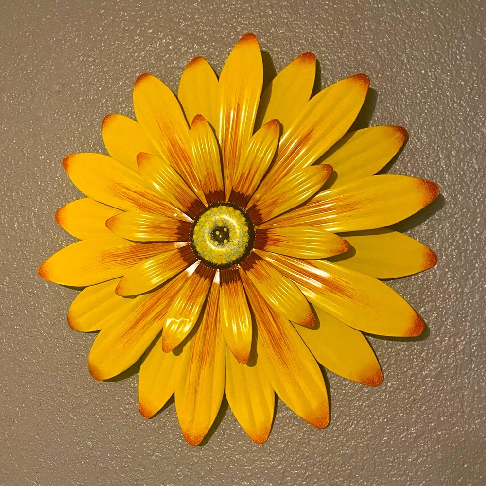 Yellow metal flower sign